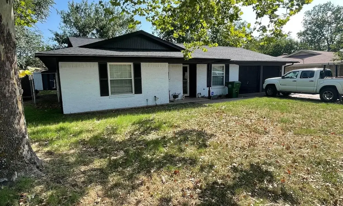 Professional roofing crew working on a residential roof in Bel Air